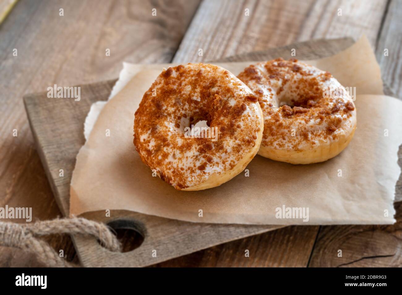 Two donuts on the wooden board Stock Photo
