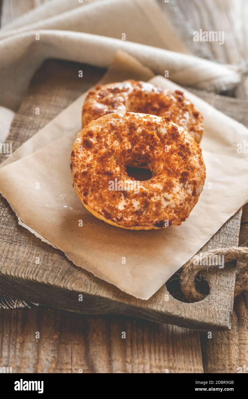 Two donuts on the wooden board Stock Photo