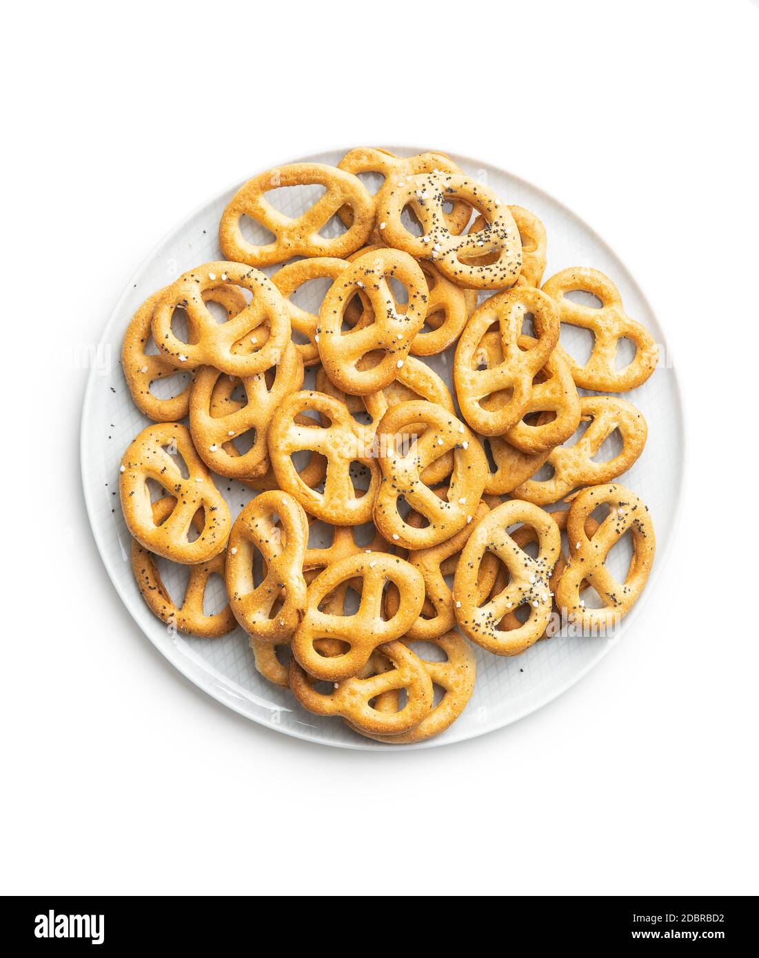 Crispy salted pretzels on plate isolated on white background Stock