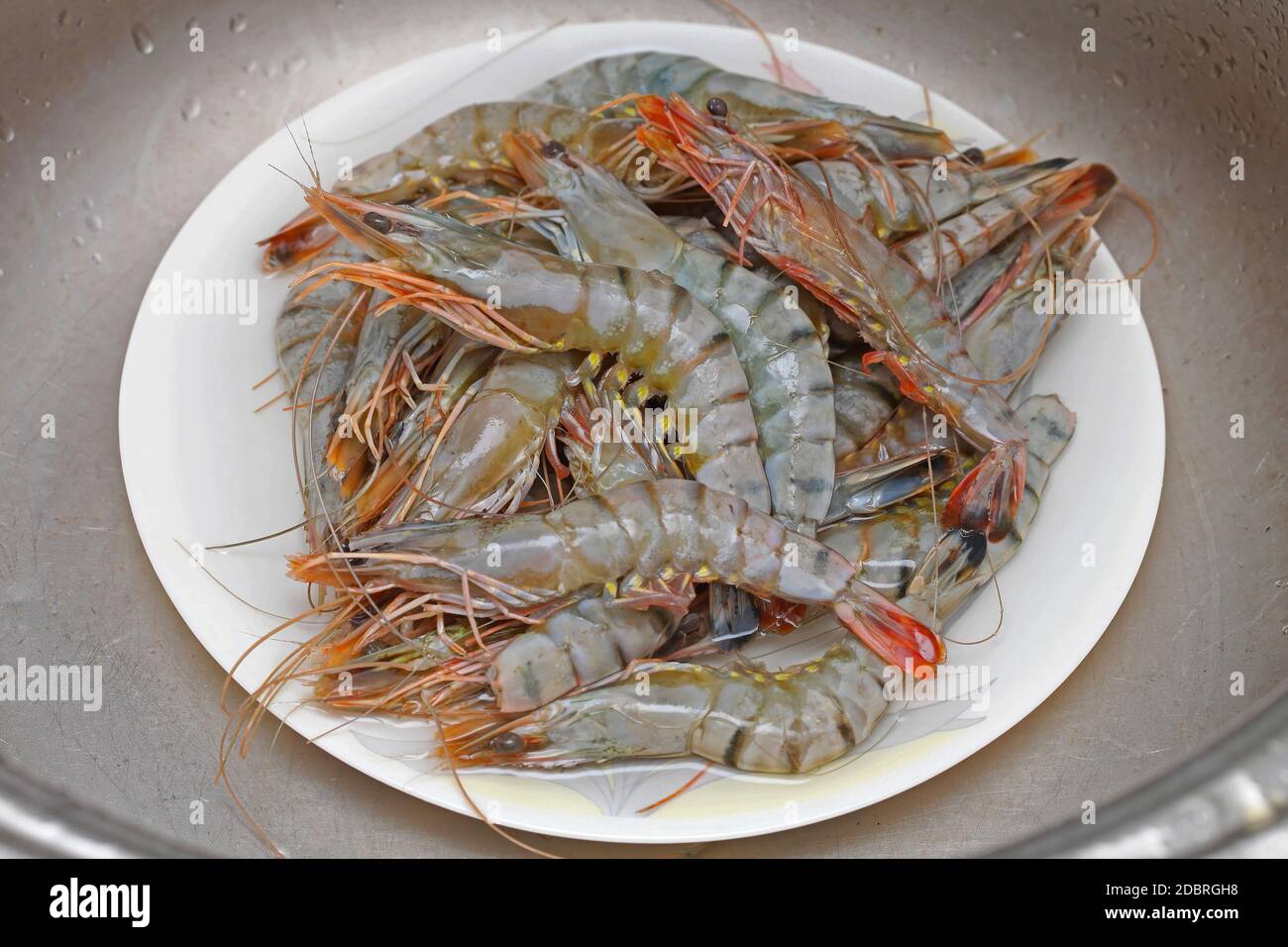 Bunch of Big Tiger Prawns Seafood Crustaceans at Plate Stock Photo