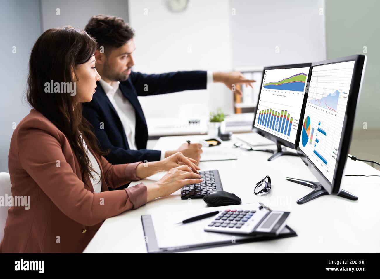 Financial Advisor And Business Analyst Working On Computer Stock Photo