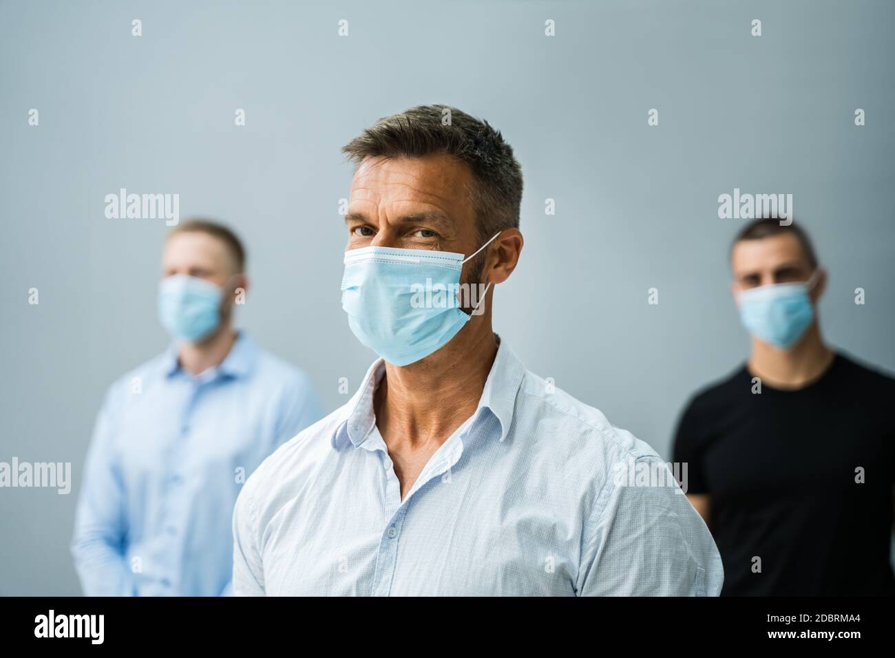 Group Of Office Employees Wearing Medical Face Masks Stock Photo - Alamy