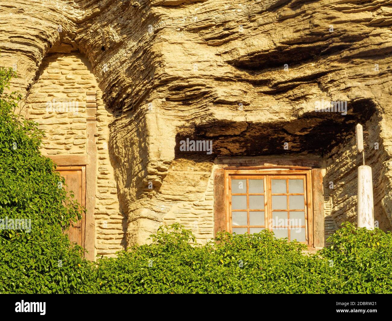 Upgraded cave dwelling with door and window - Belorado, Castile and León, Spain Stock Photo