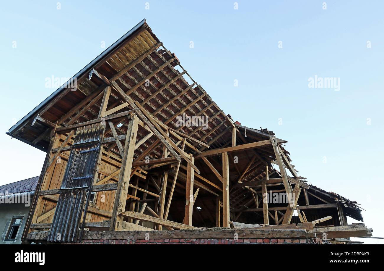 An old wooden house is being torn down Stock Photo