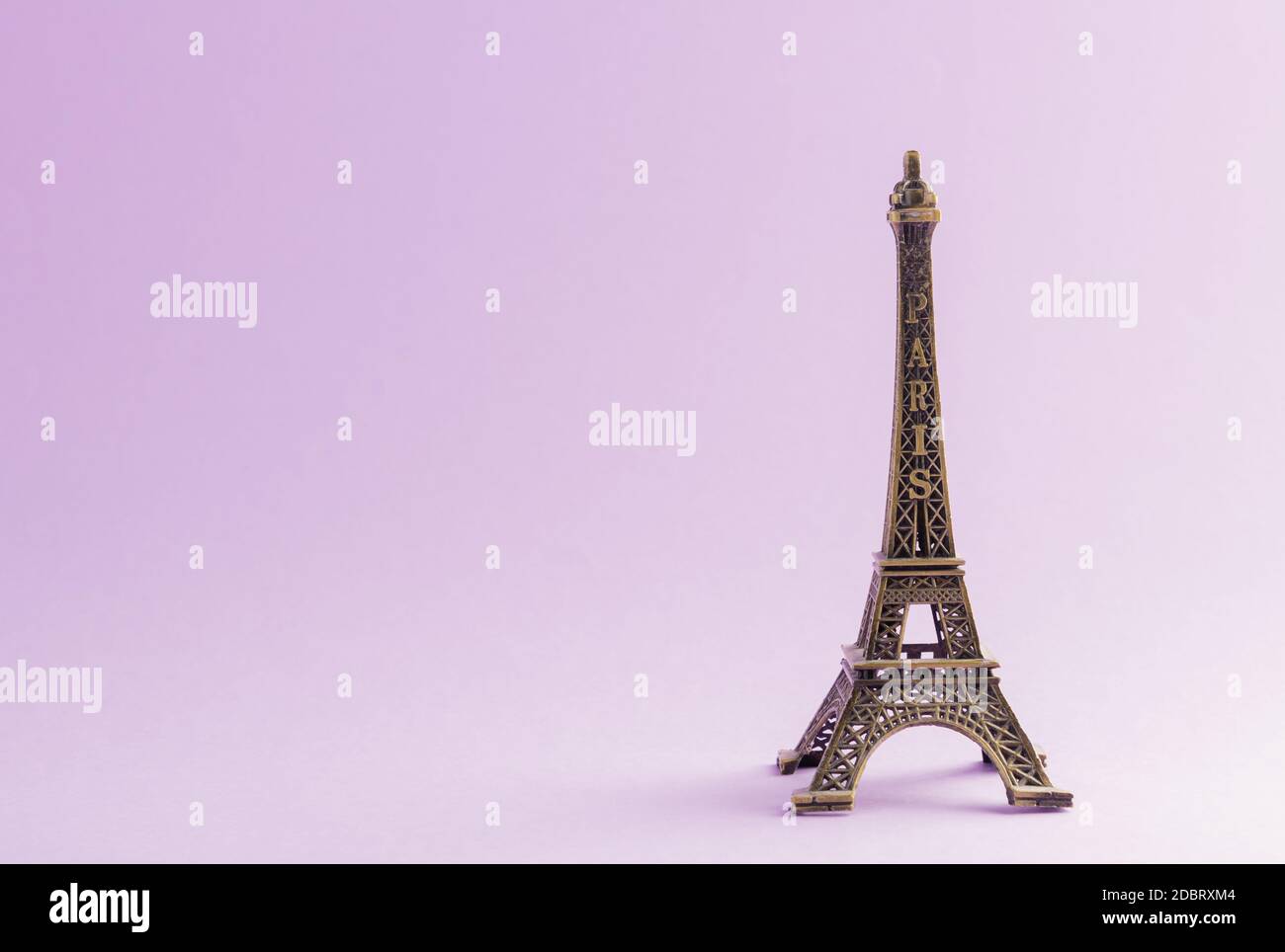 Paris France monument Eiffel tower famous landmark model, studio shot isolated on purple background Stock Photo
