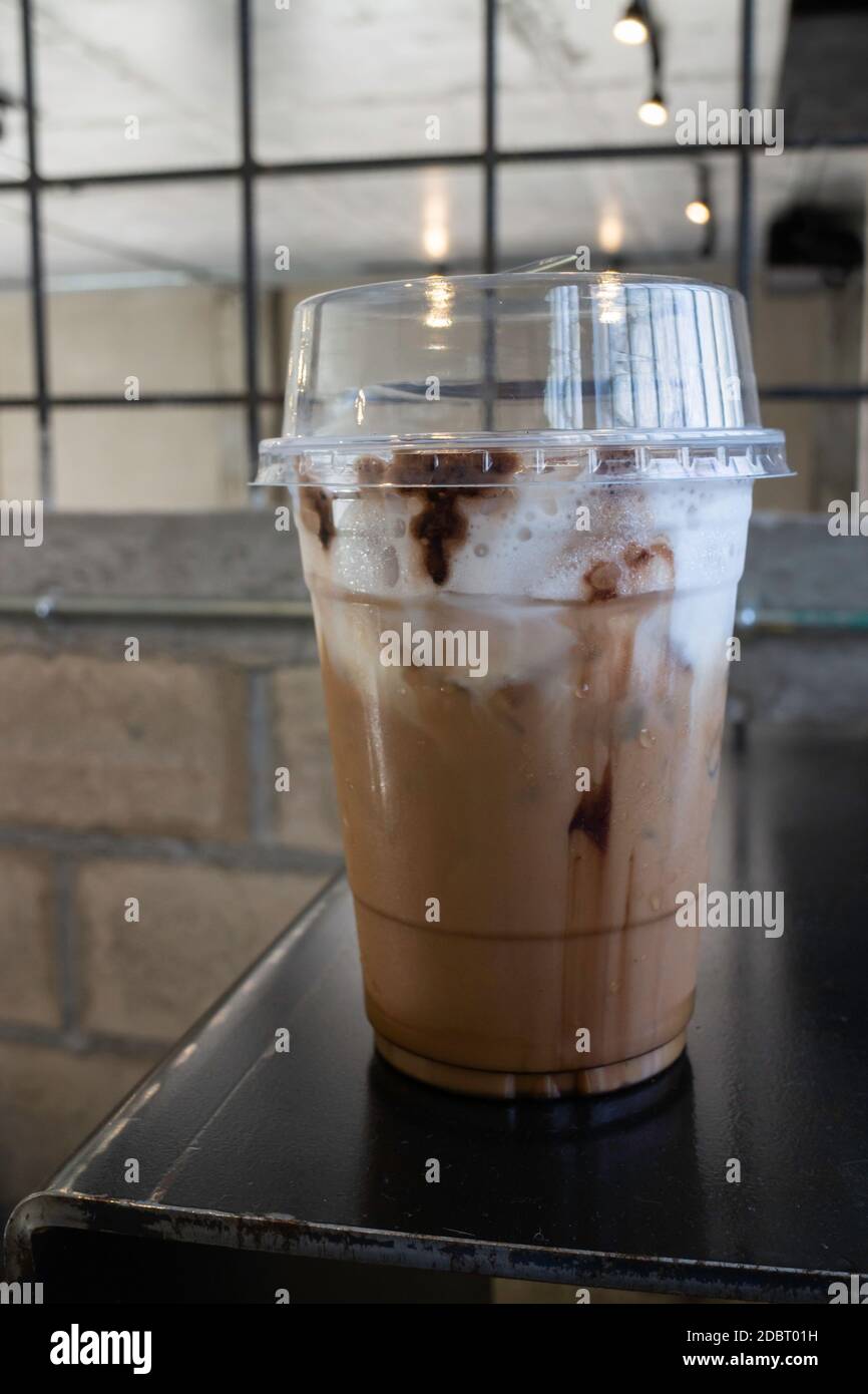 Vanilla iced latte served in a plastic to go cup Stock Photo - Alamy