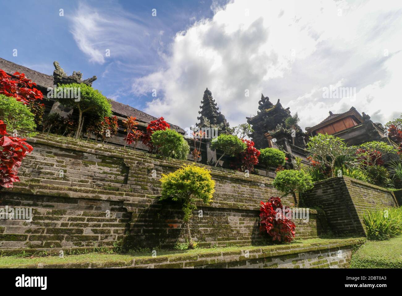 Temples in Pura Penataran Agung Besakih complex, the mother temple of Bali Island, Indonesia. Green lawn with several balinese temples with Travel and Stock Photo