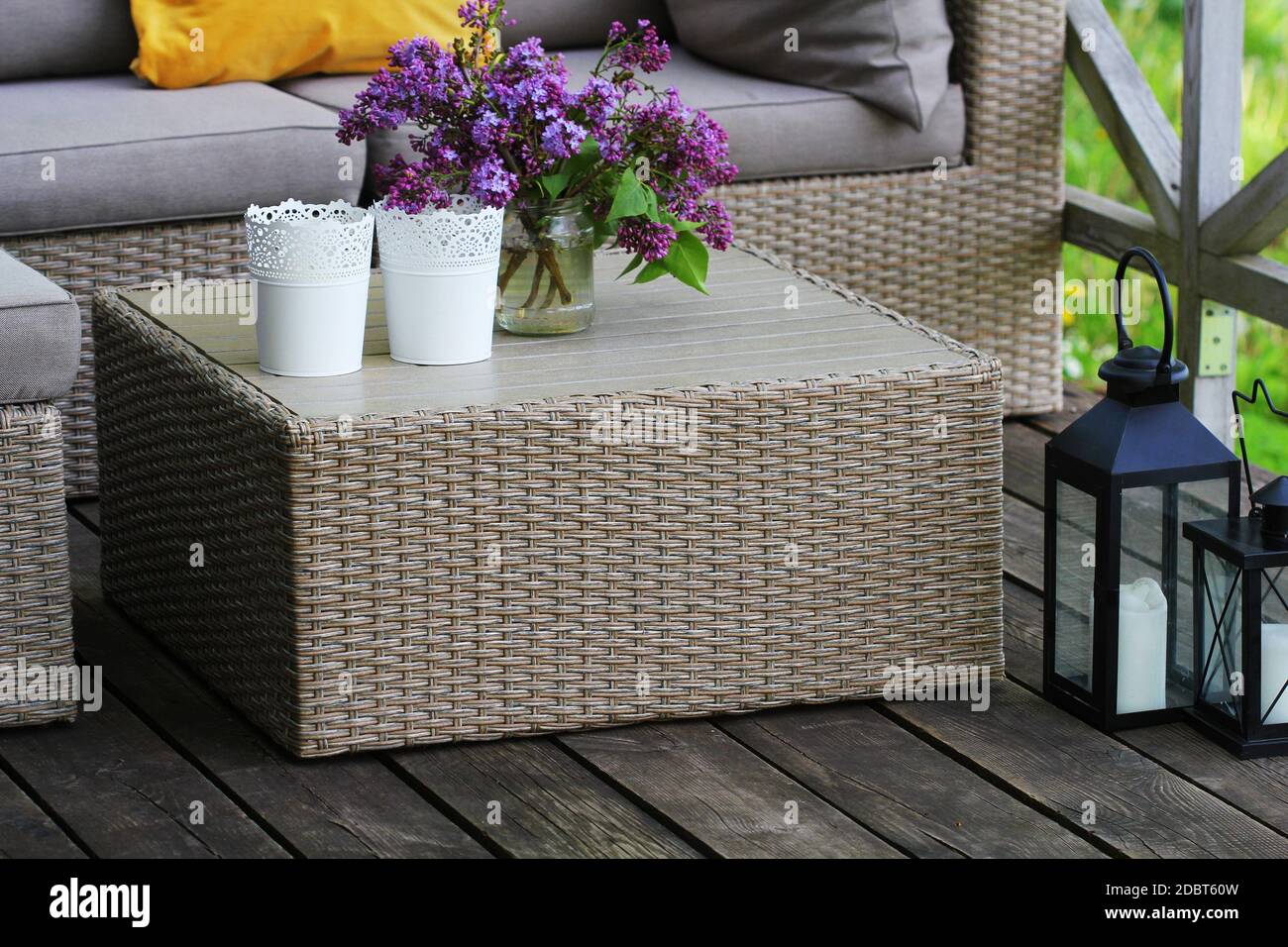 Outdoor furniture lounge group with chairs, sofa and table in a patio