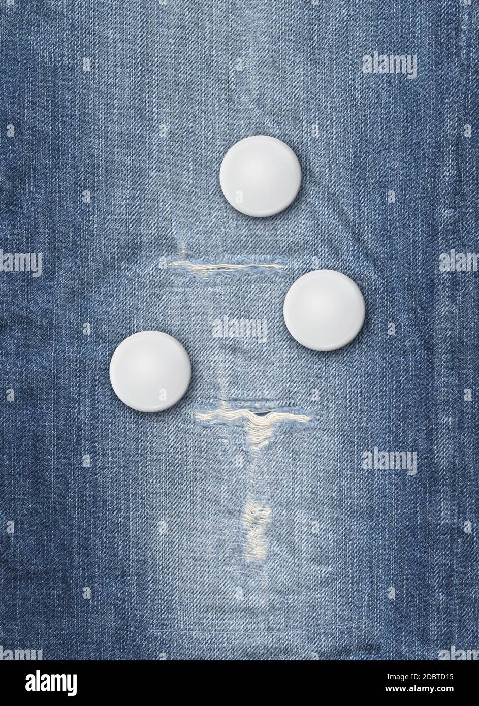Three blank badges on a blue denim background Stock Photo