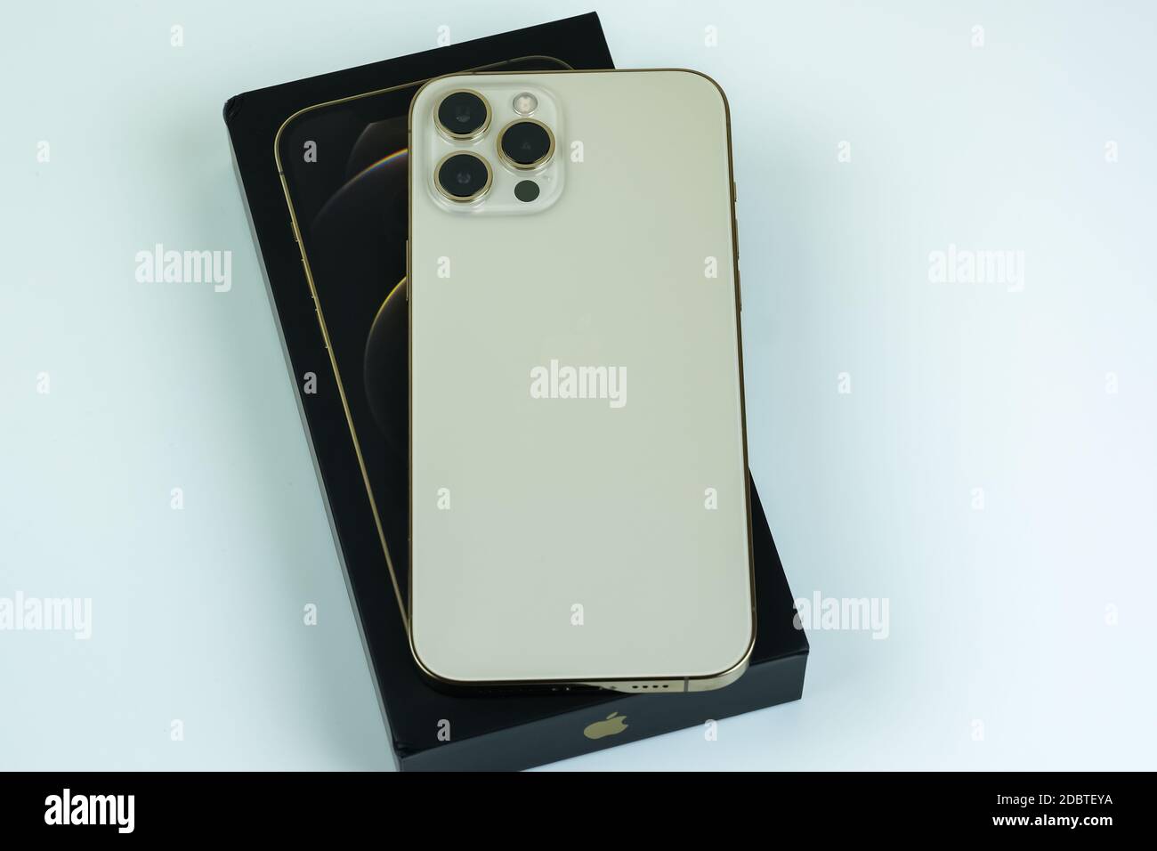 Iphone 12 Pro Max In Gold Next To Its Box Stock Photo Alamy