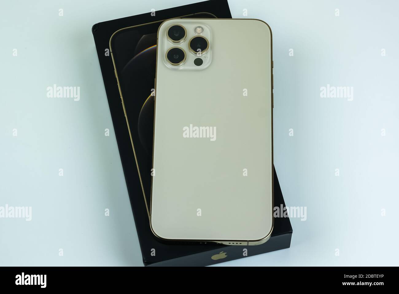 Iphone 12 Pro Max In Gold Next To Its Box Stock Photo Alamy