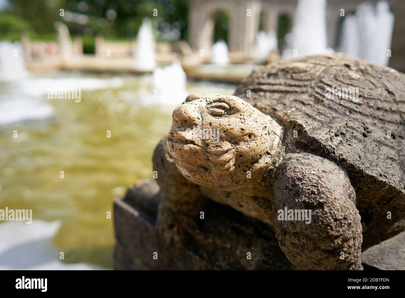 Figure of a Turtle at the MÃ¤rchenbrunnen fairytale fountain from 1913 in the public Volkspark Friedrichshain in Berlin Stock Photo