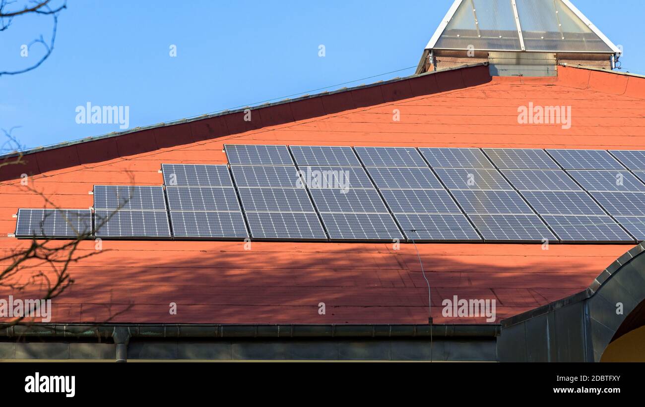 View of the solar panels in a rows installed on the roof Stock Photo ...