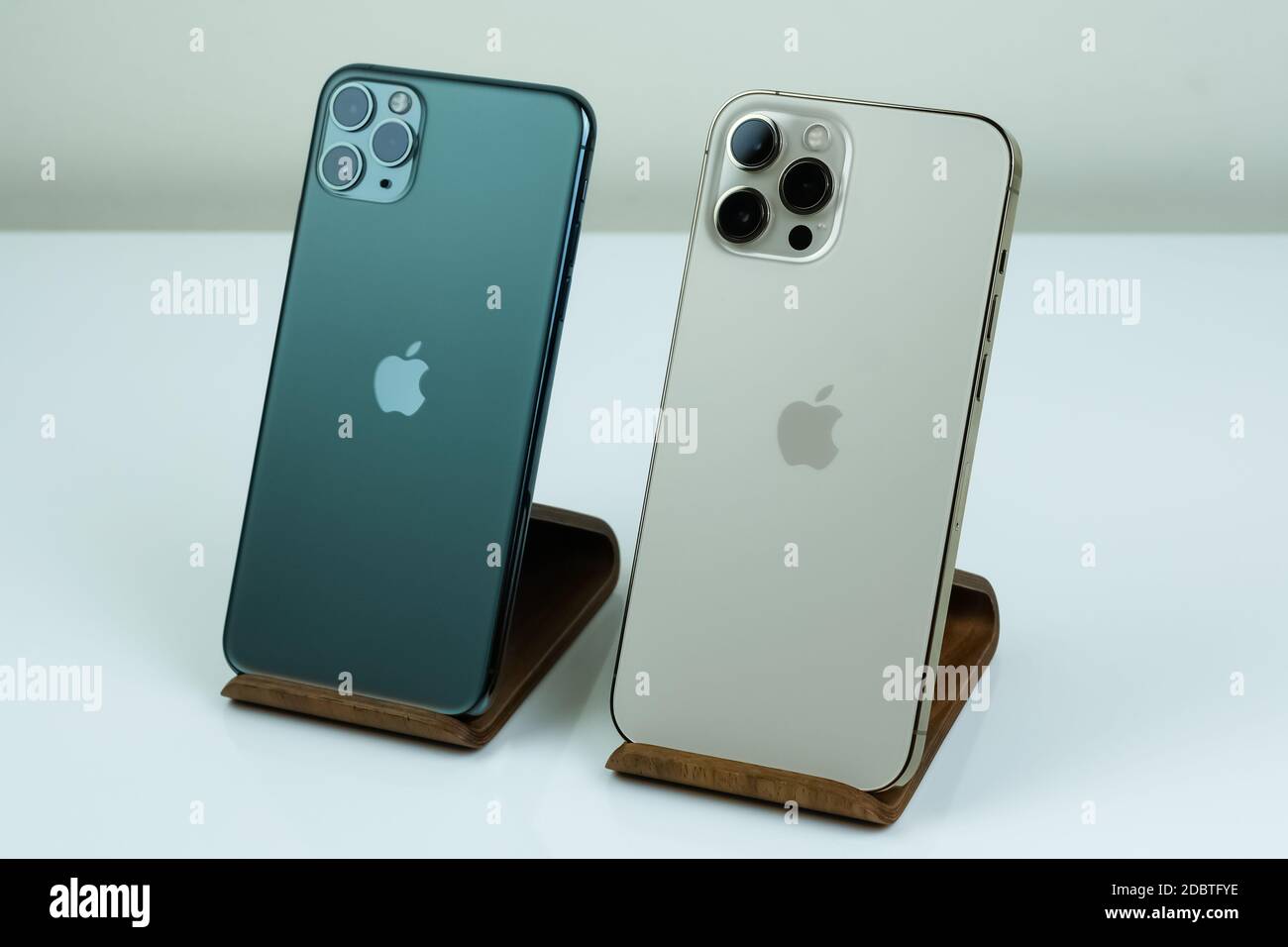 Iphone 12 Pro Max In Gold Next To Iphone 11 Pro Max In Midnight Green Color Stock Photo Alamy