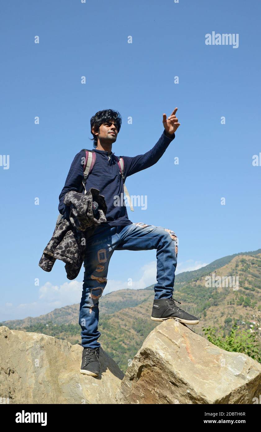 Man resting on the rock in Himachal Pradesh Stock Photo