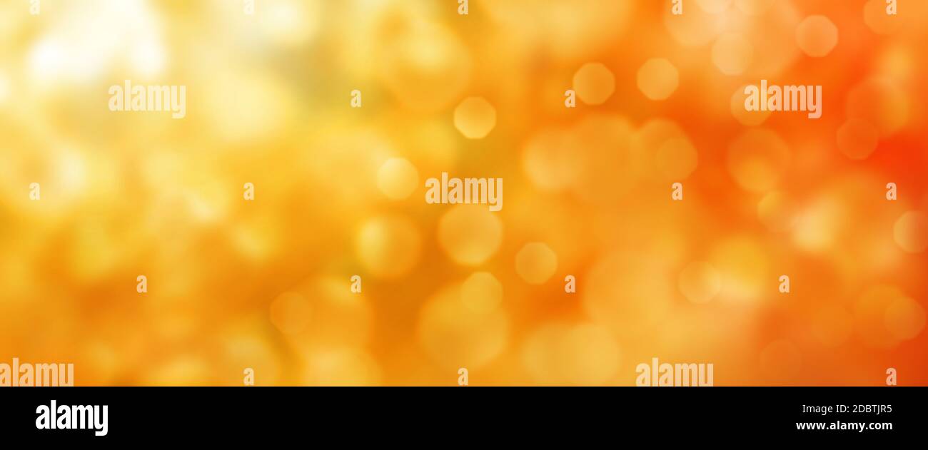 Abstract orange golden bokeh textur. Horizontal background for a saisonal concept design with space for text. Stock Photo