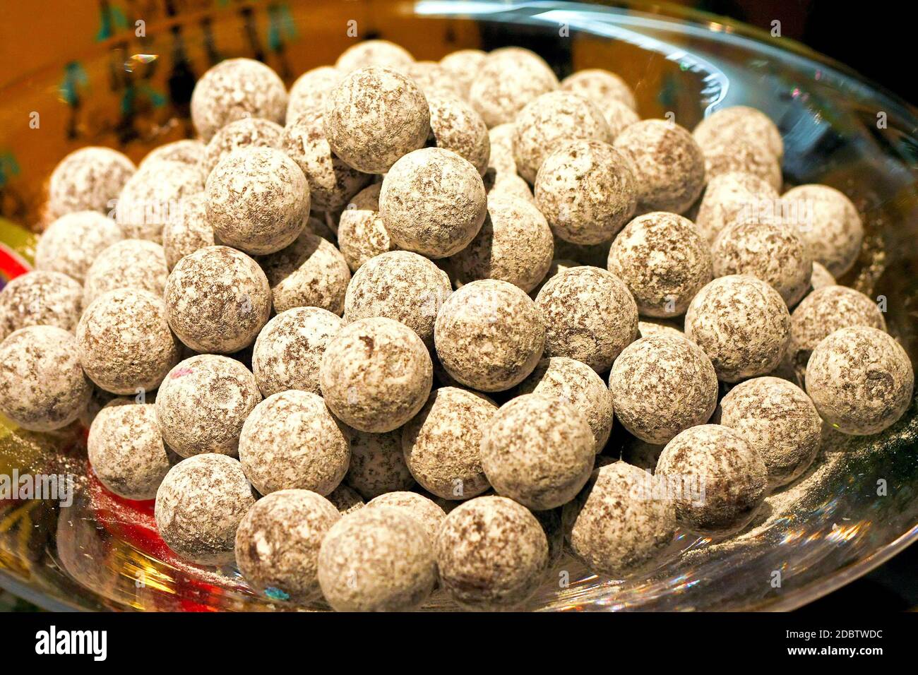 Big glass bowl with delicious truffle balls Stock Photo Alamy