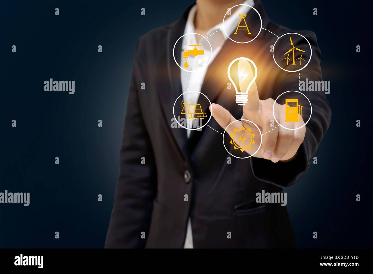 Business people holding energy-saving lamps. The work includes environmentally friendly energy source icons, energy saving ideas, and environmentally Stock Photo
