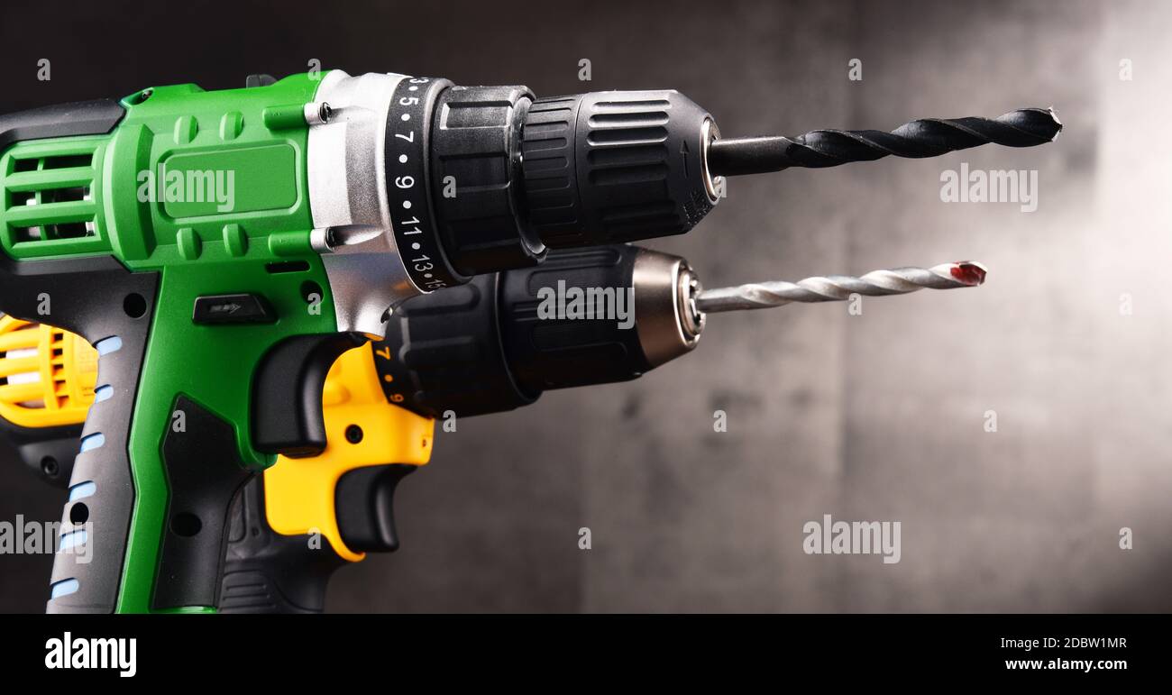 Two cordless drills with drill bits working also as screw guns. Stock Photo