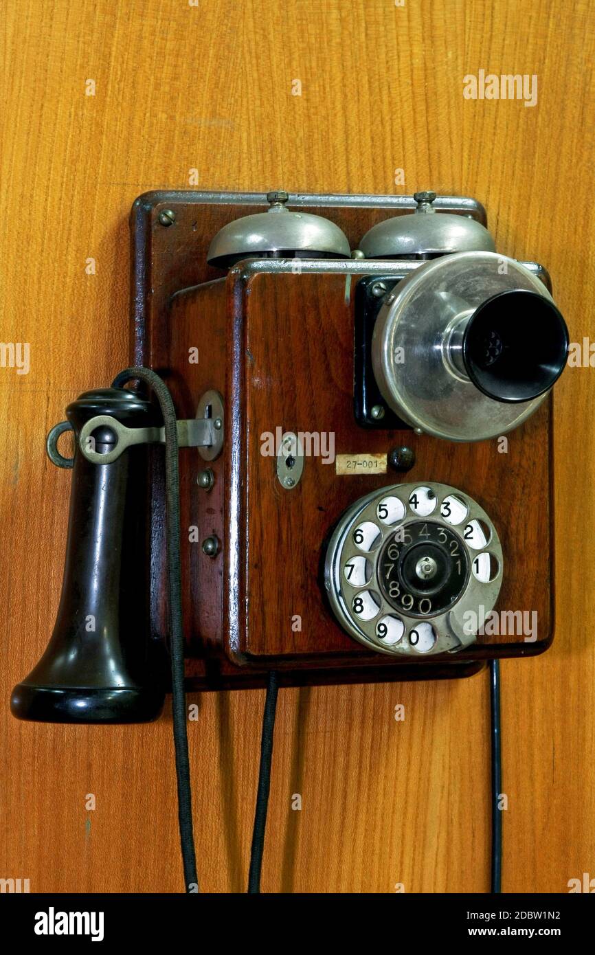Old telephone mounted on wall hi-res stock photography and images - Alamy