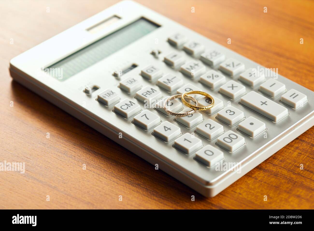 Wedding Rings On The Electronic Calculator Stock Photo Alamy