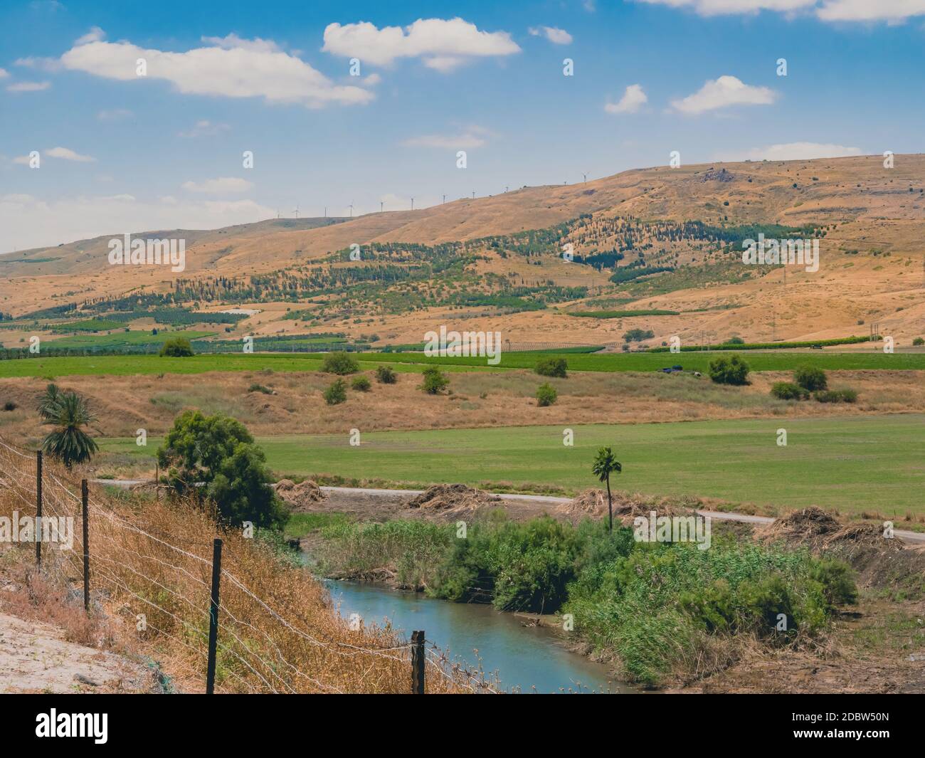 Landscape of country area of northern Israel of Jordan Valley. Mountains  with wind turbines and green agricultural fields in the valley are in the  bac Stock Photo - Alamy