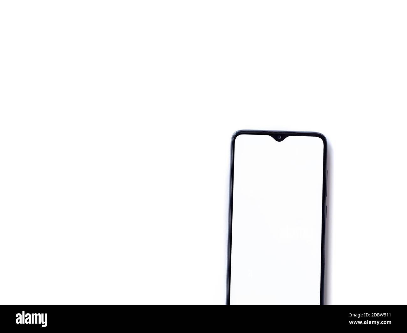 Black mobile smartphone mockup lies on the surface with blank screen ...
