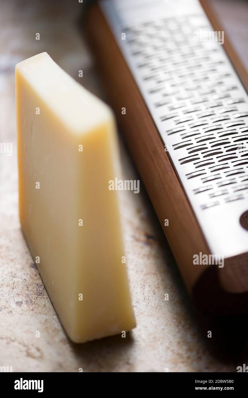 rustic italian cheese dairy with grater Stock Photo