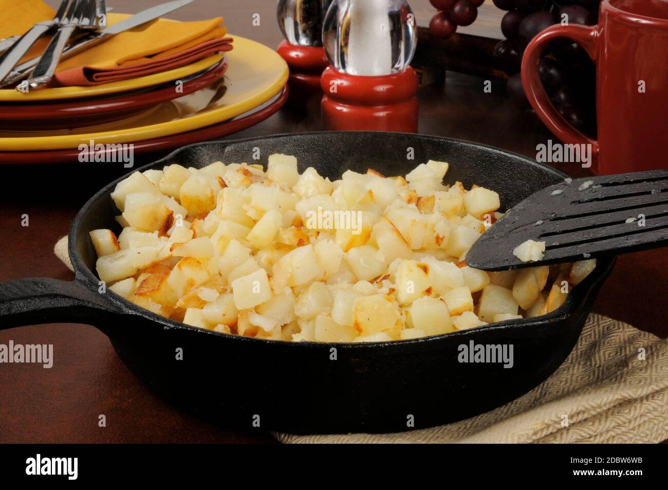 Southern style hash brown potatoes in a cast iron skillet Stock Photo ...