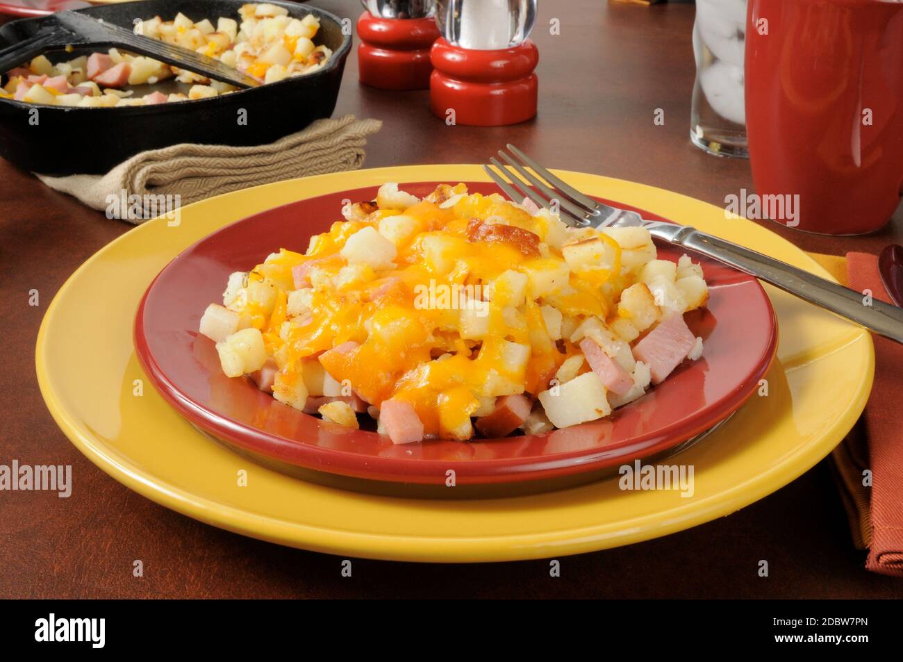 Southern style hash browns with diced ham and cheddar cheese Stock