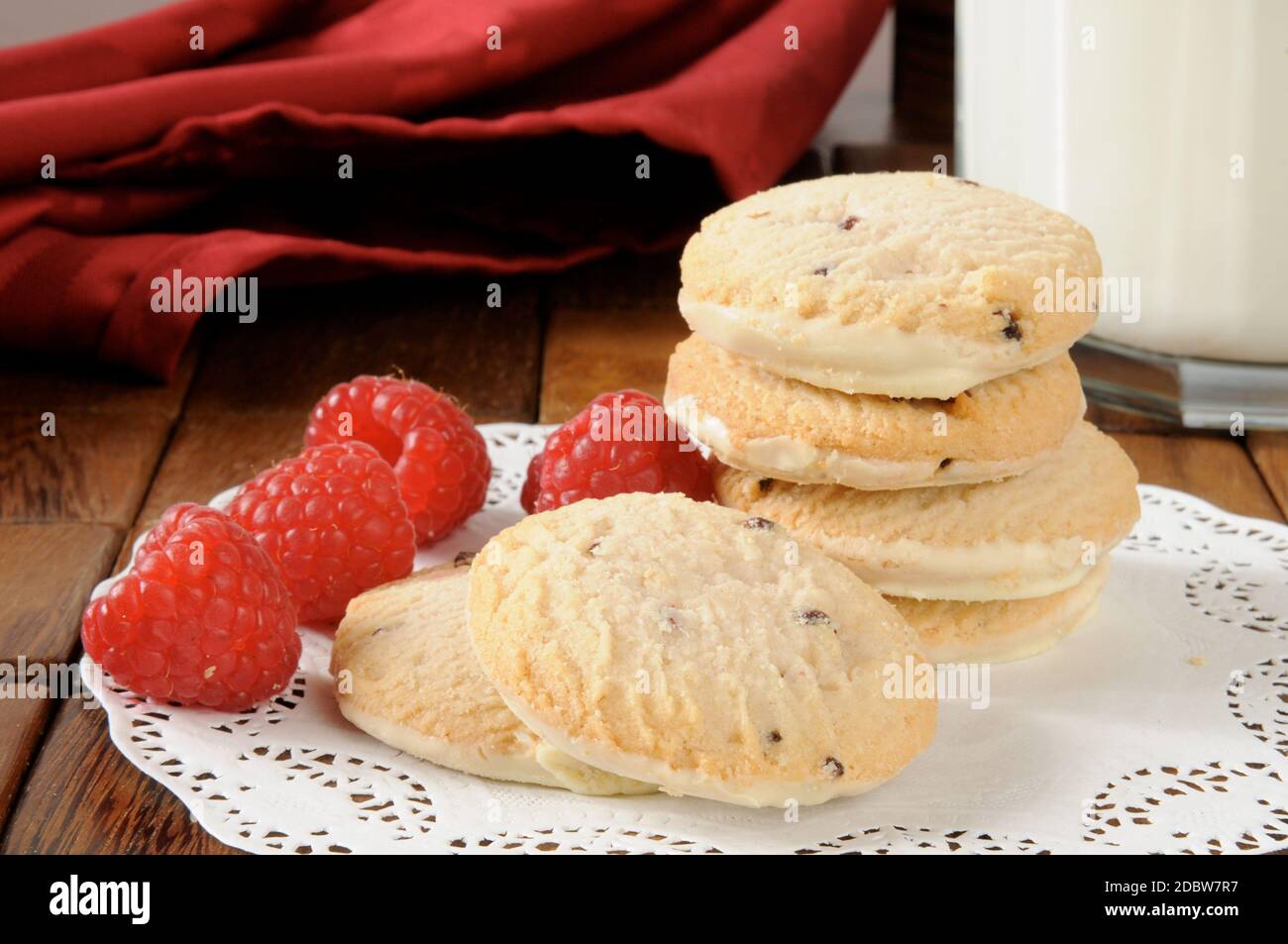 Gourmet raspberry shortbread cookies with a glass of milk Stock Photo ...