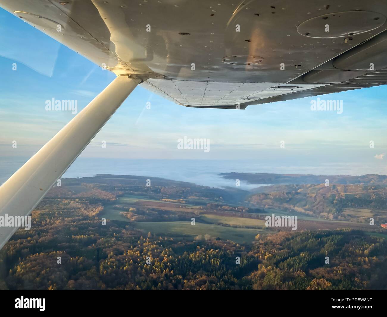 Beautiful aerial view of countryside during sunset from a Cessna Plane ...