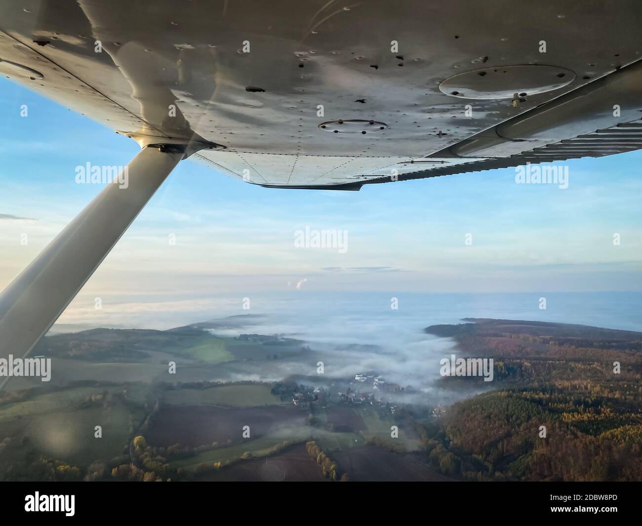 Beautiful aerial view of countryside during sunset from a Cessna Plane ...