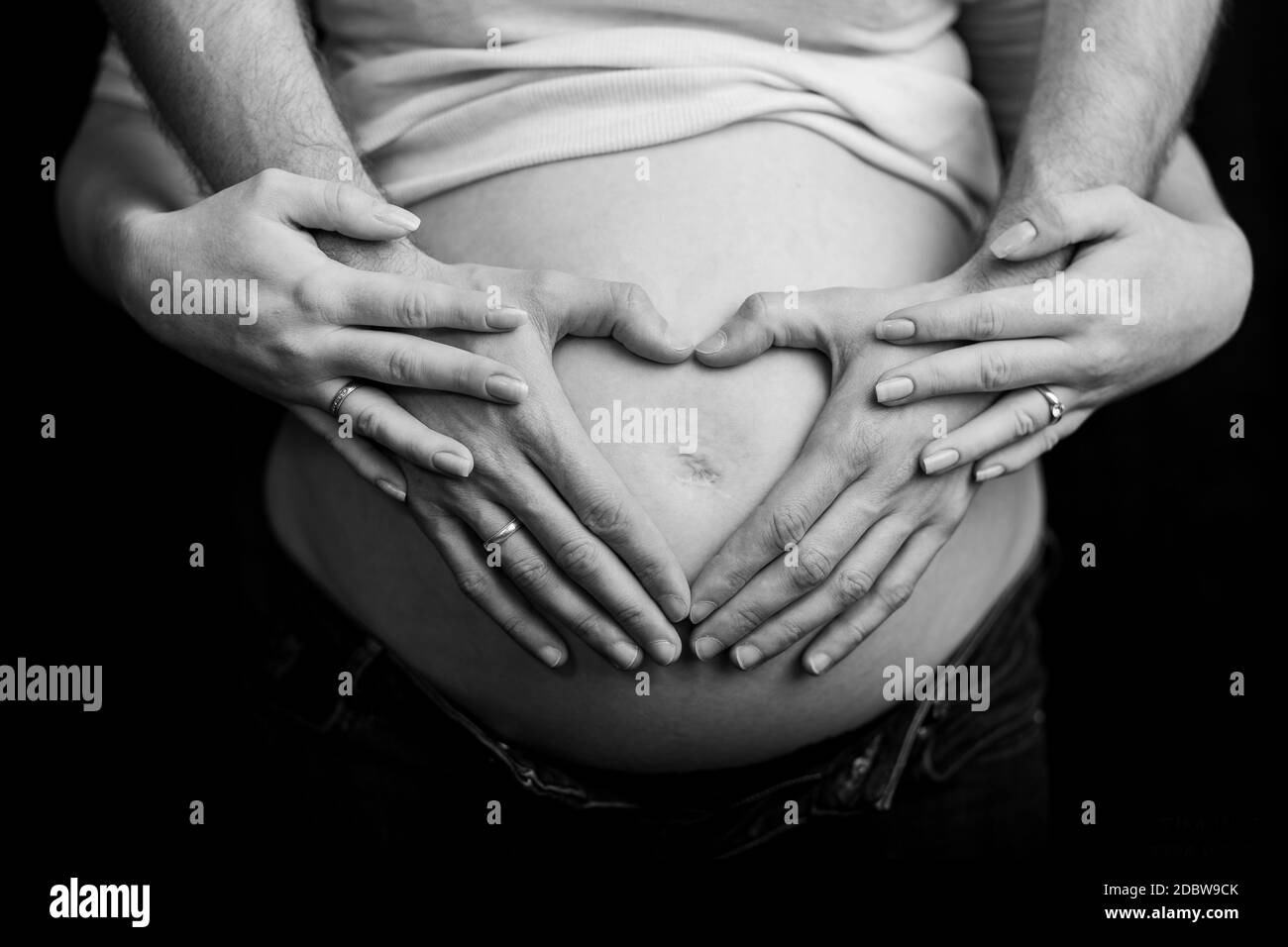 Heart hands on pregnant belly Black and White Stock Photos & Images Alamy