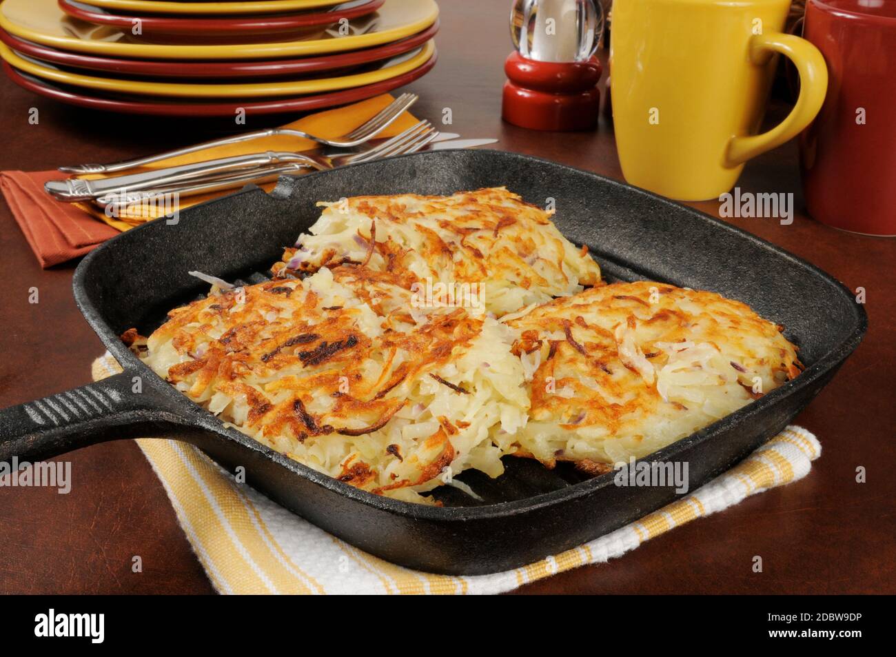 Fried potato latkes in a cast iron skillet Stock Photo Alamy