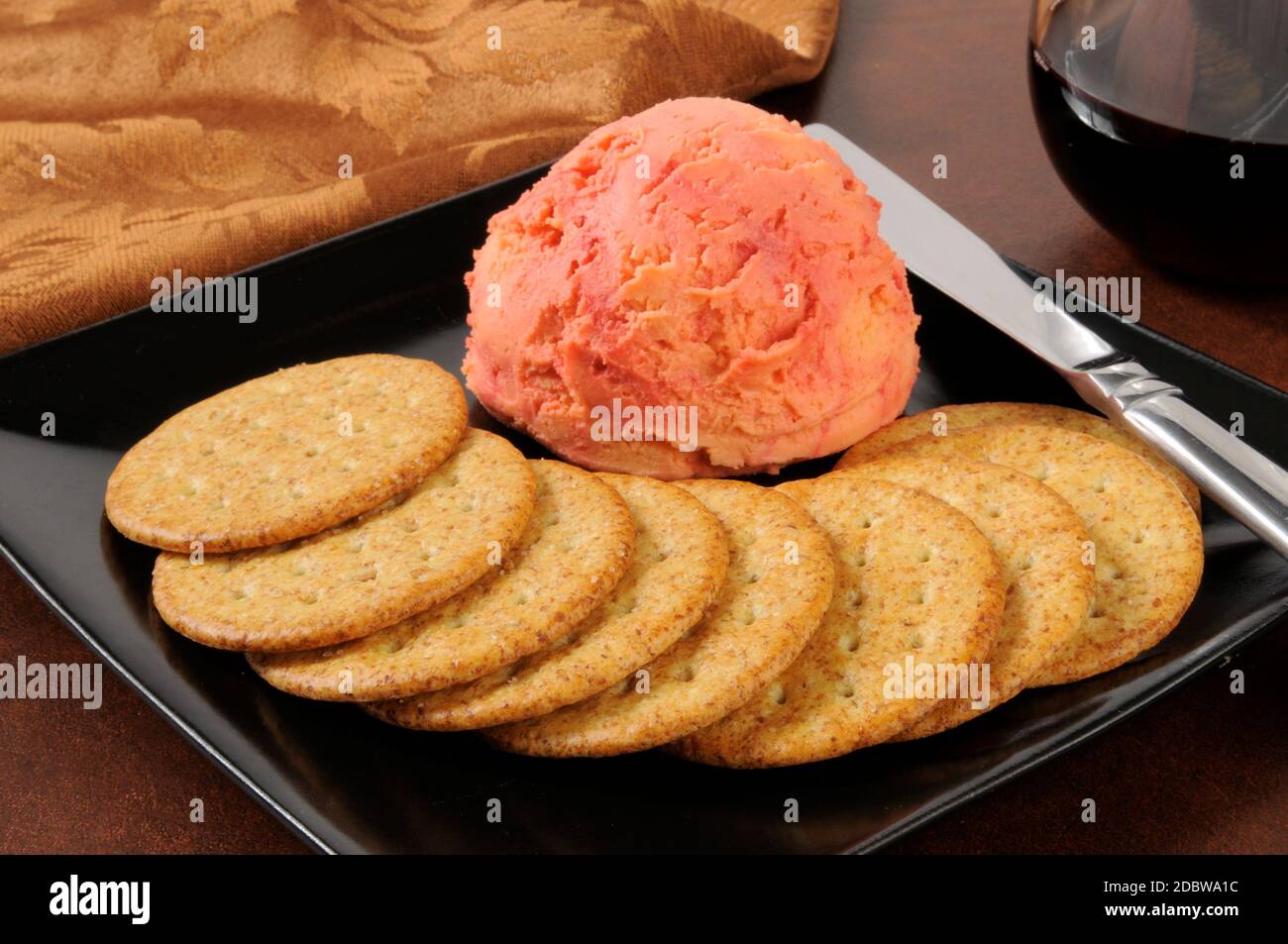 A Port wine and cheddar cheese ball with crackers Stock Photo Alamy