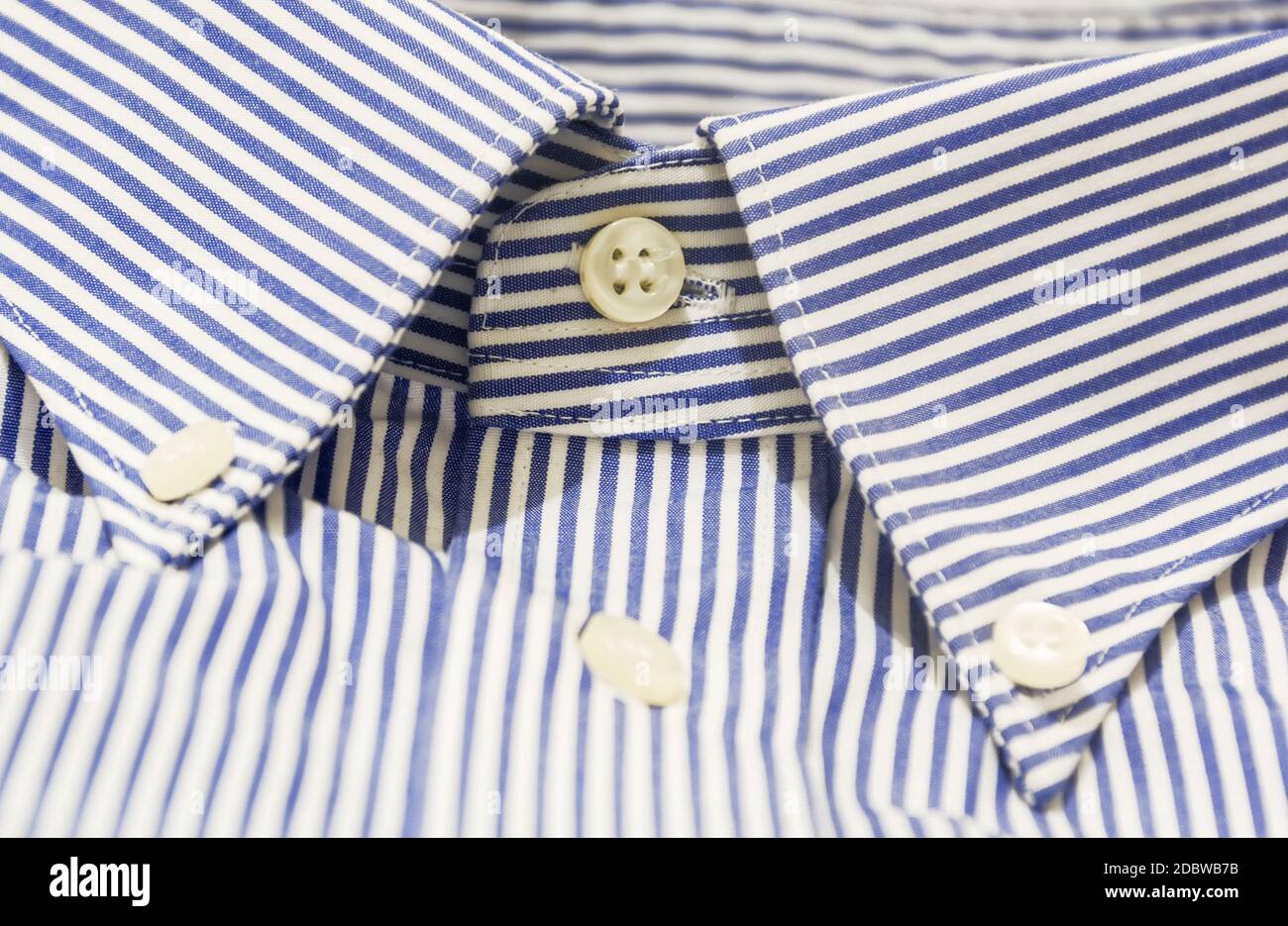 A blue striped shirt with a button down collar. Formal wear for events