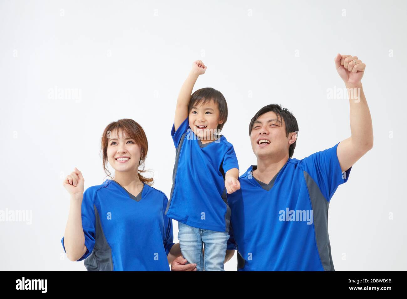 Family Watching A Game And Cheering Stock Photo - Alamy