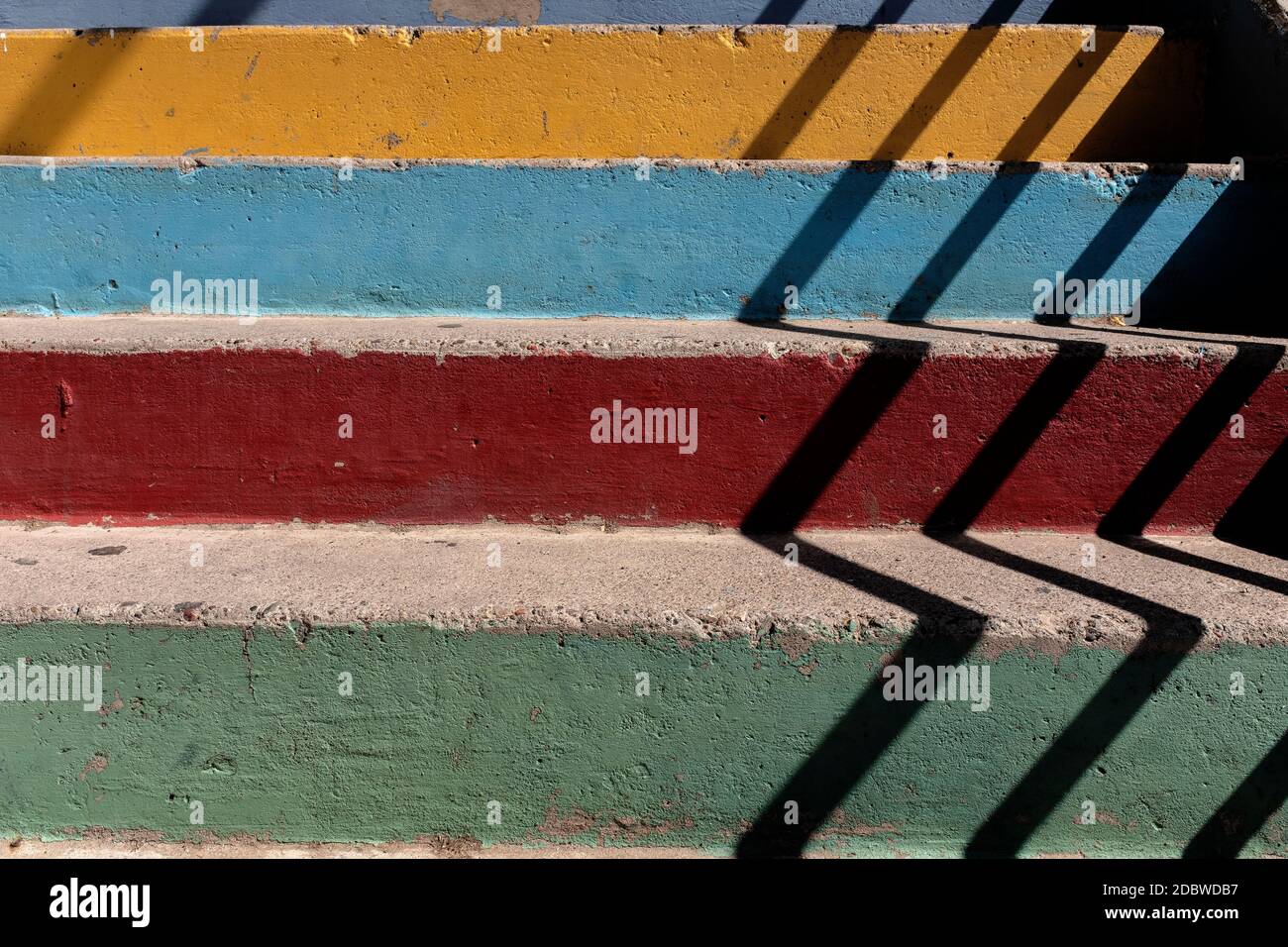 pastel colored concrete stairs with shadows Stock Photo