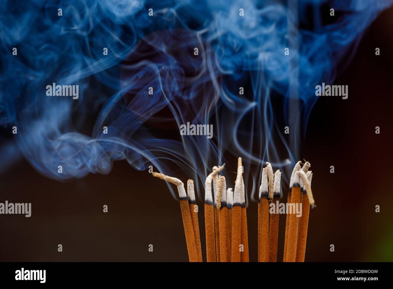 Smoking incense in a temple Stock Photo