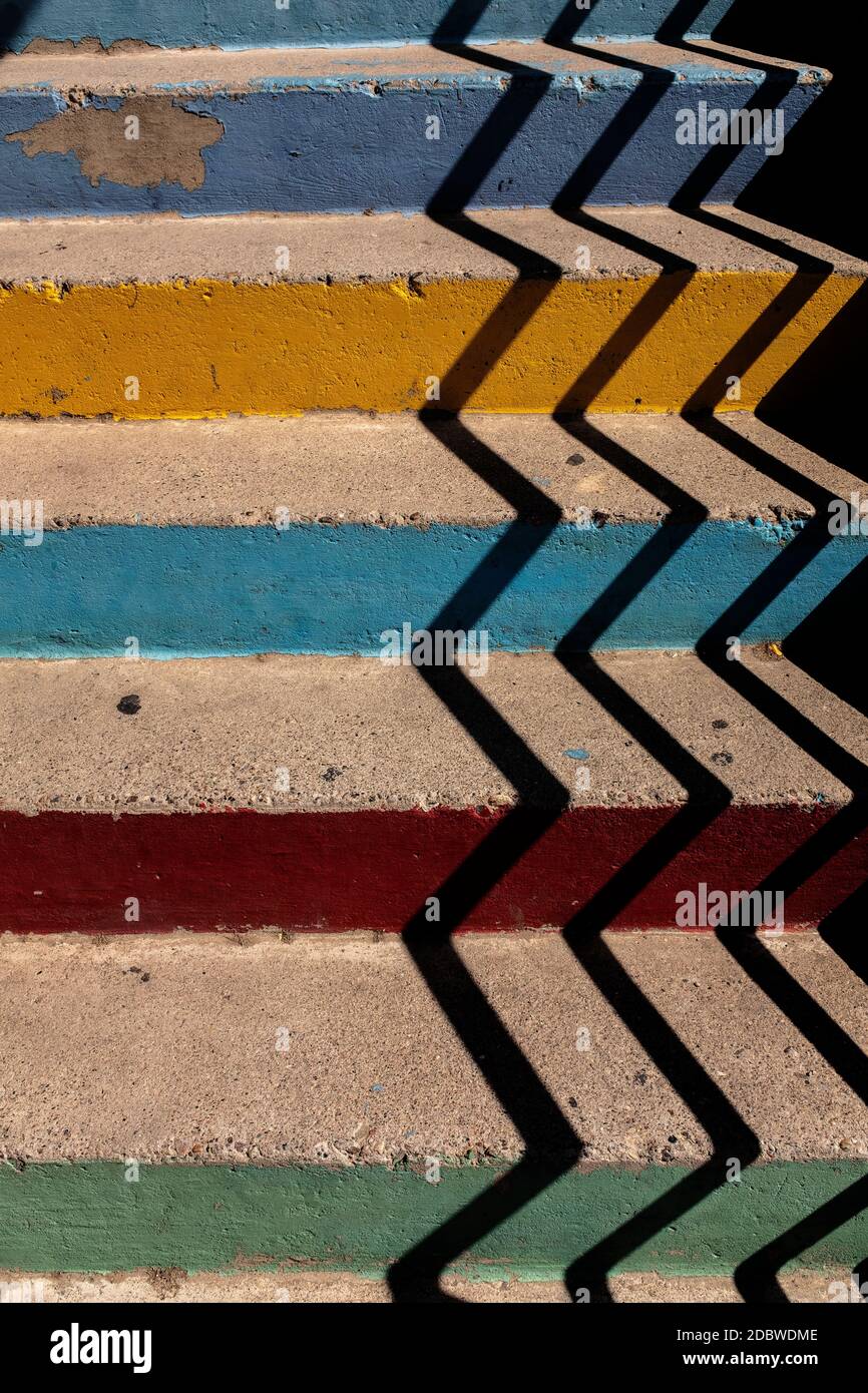 pastel colored concrete stairs with shadows Stock Photo