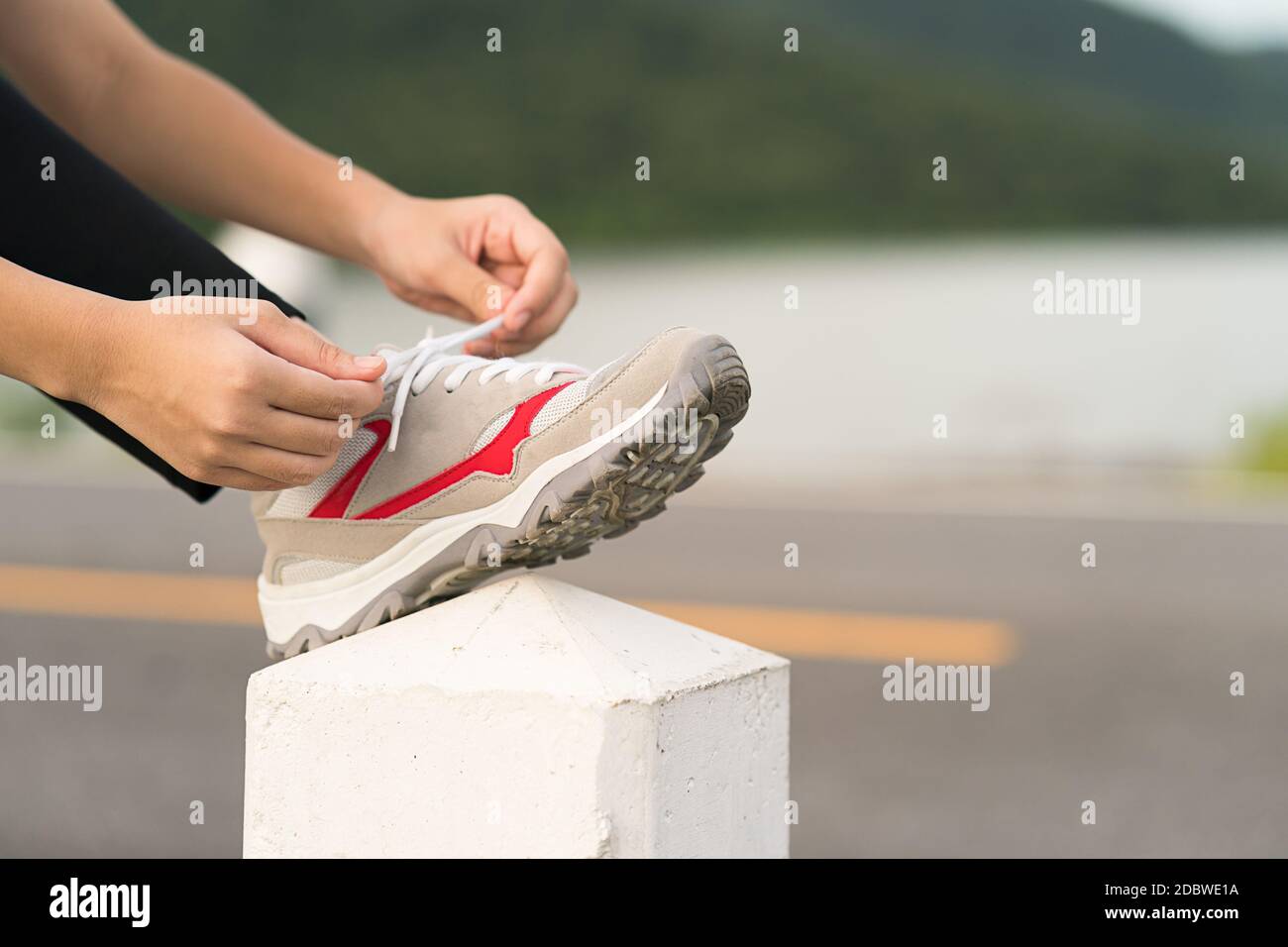 Picture Idea: Woman Runner Tying Shoelace His Before Starting Running Woman Doing