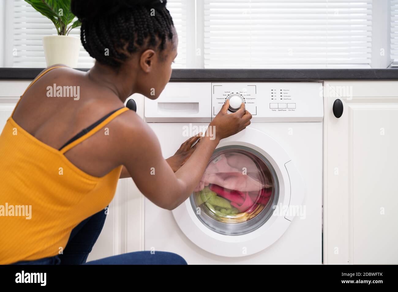 Person Hand Setting Washing Machine For Clothes Laundry Stock Photo Alamy