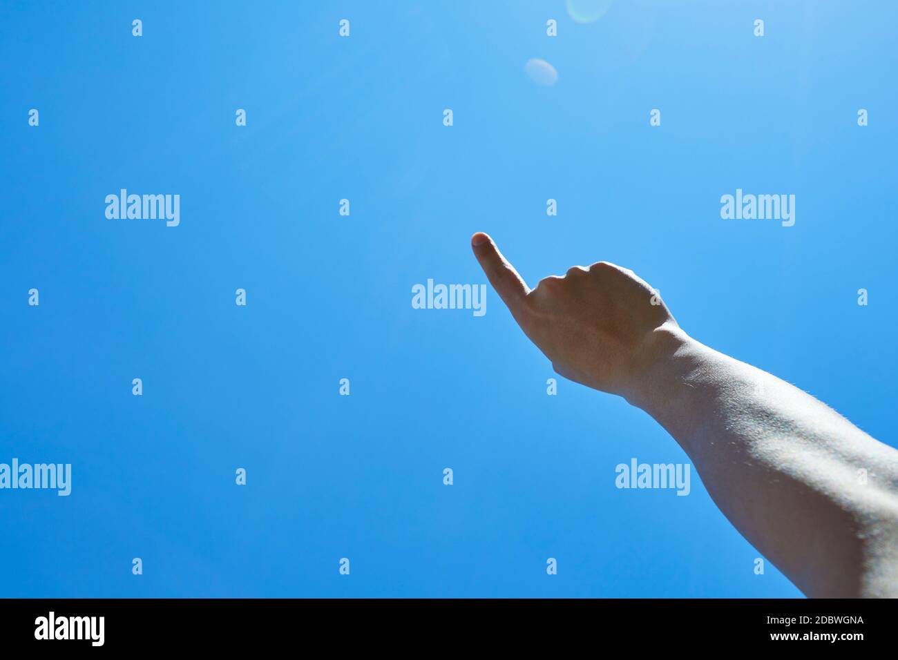 Raised Hand To The Sky Stock Photo - Alamy