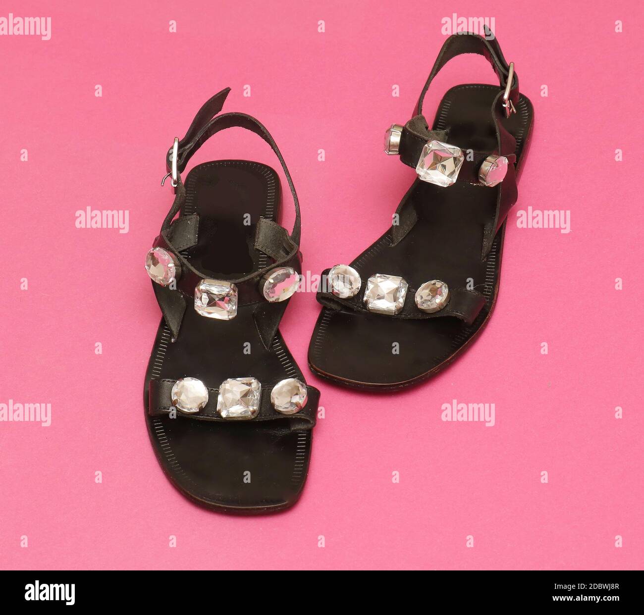 Elegant modern female leather sandals with open toes and diamond