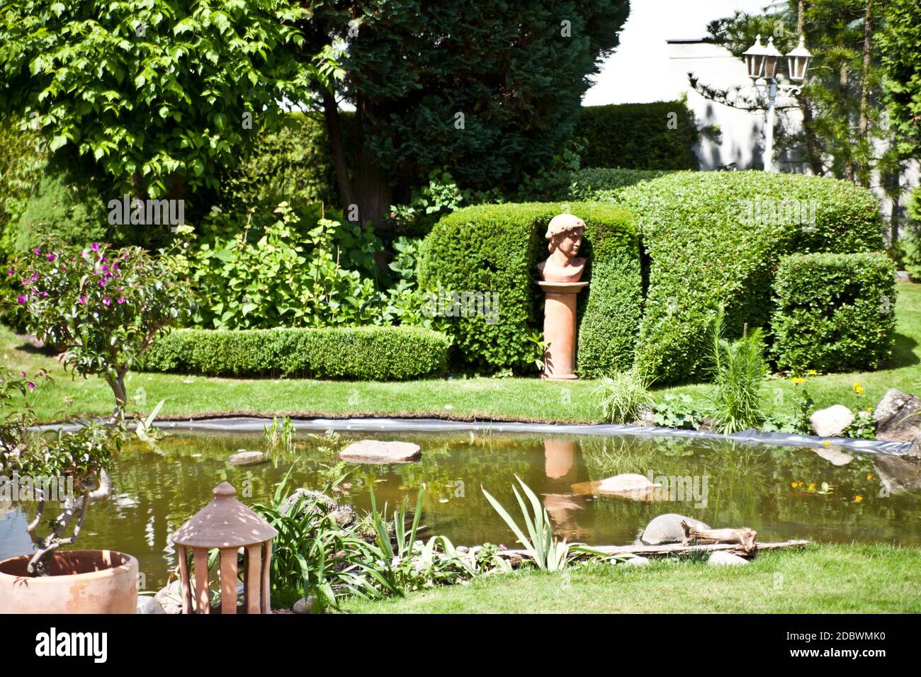 Garden pond with decoration Stock Photo Alamy