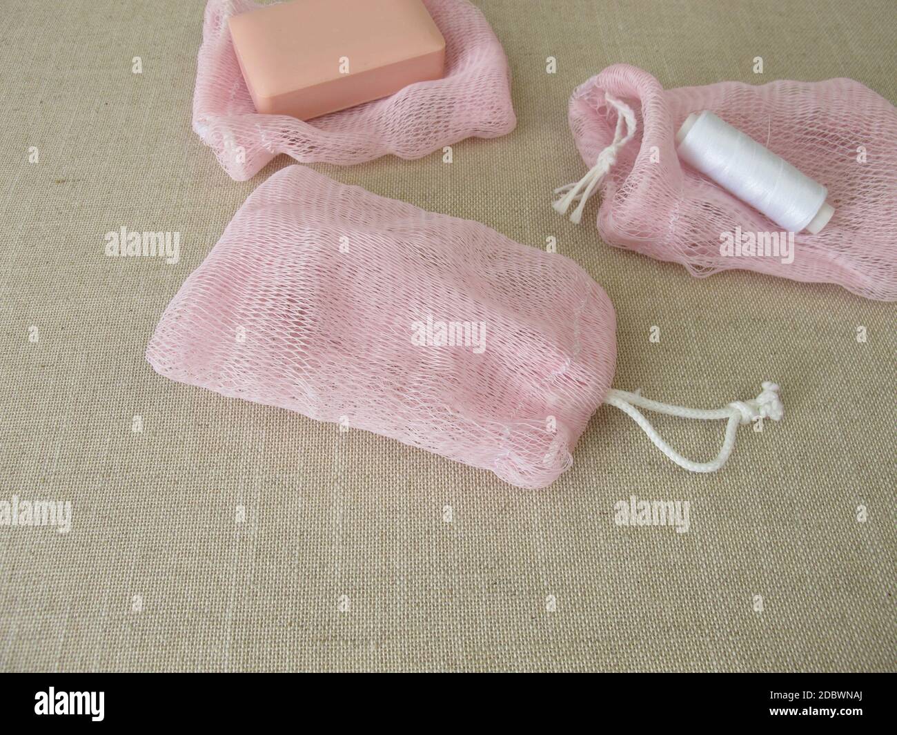 Homemade reusable soap sack and a soap bar Stock Photo