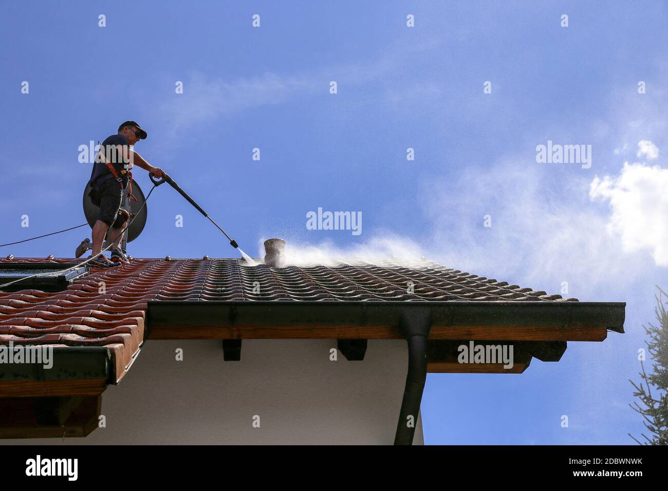 Roof cleaning with high pressure cleaner Stock Photo Alamy