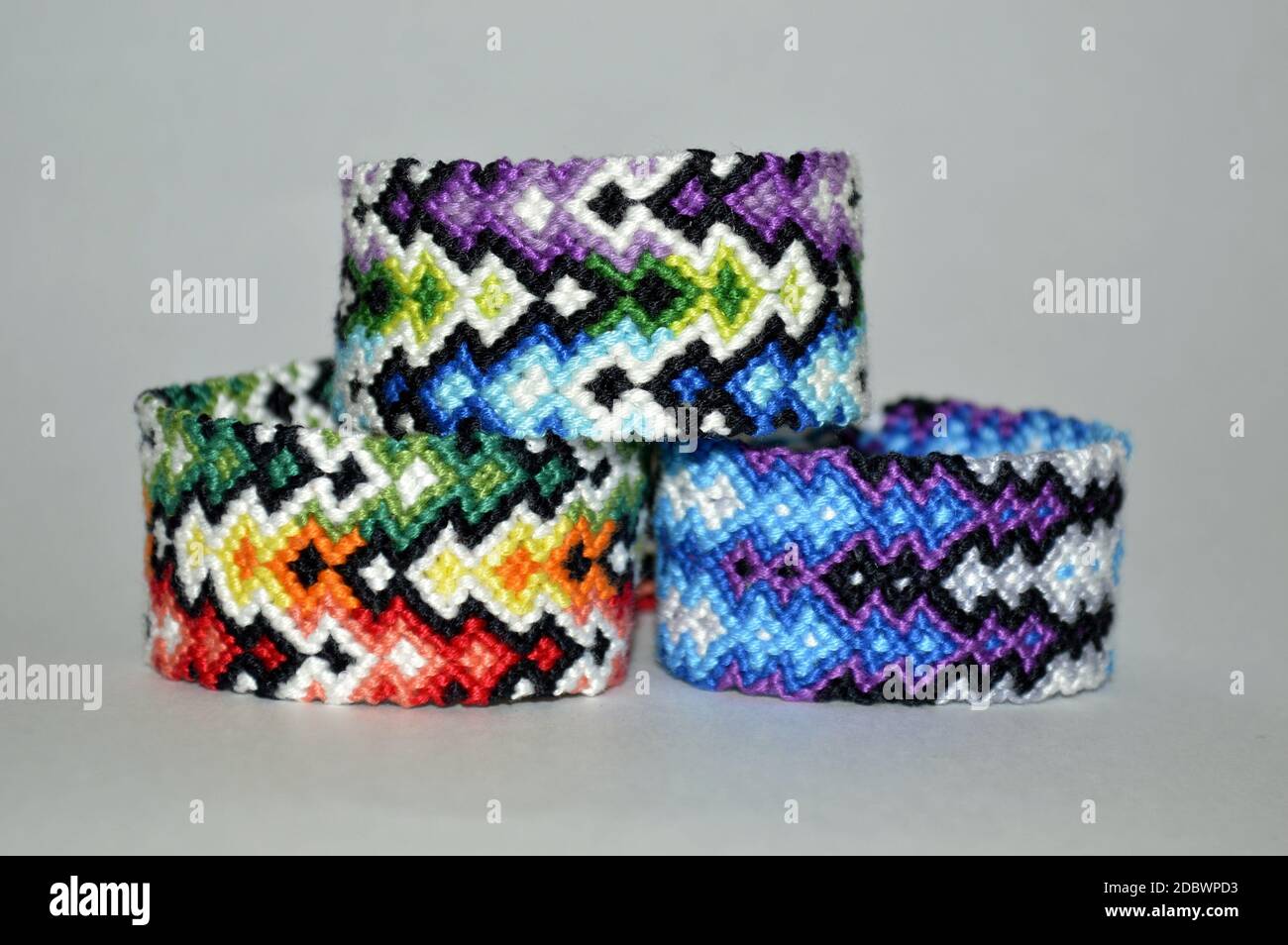 Selective Focus Of Two Tied Woven Friendship Bracelets With Bright