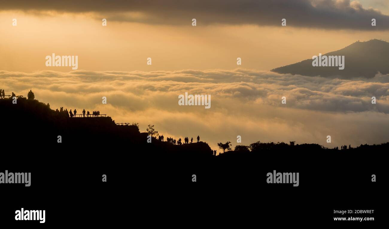 Scenic view of clouds and mist at sunrise from the top of mount Batur ...